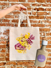 Cargar imagen en el visor de la galería, Tote bag DUNDA &amp; collab Kristal Juan Rovira + caneca coquito GRATIS
