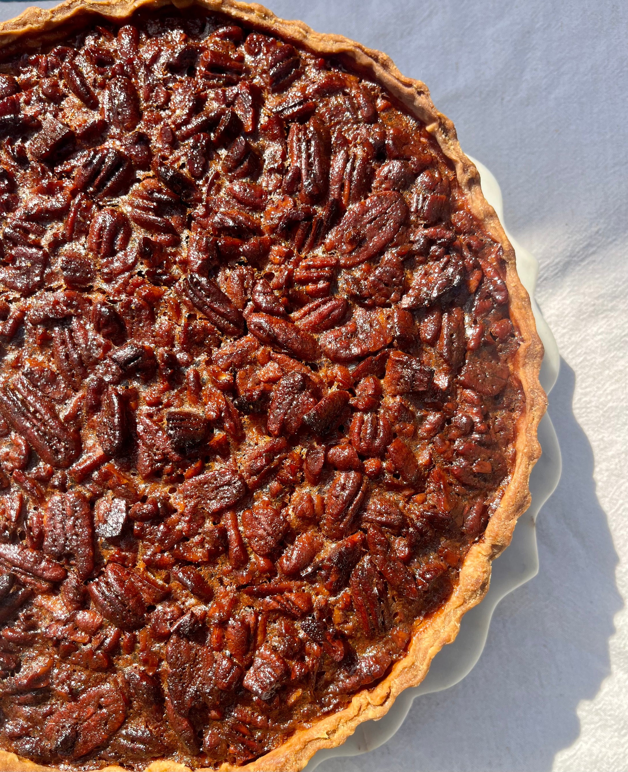 Pie de Pecans con Maple Syrup, Agua de Azahar y Piel de Naranja